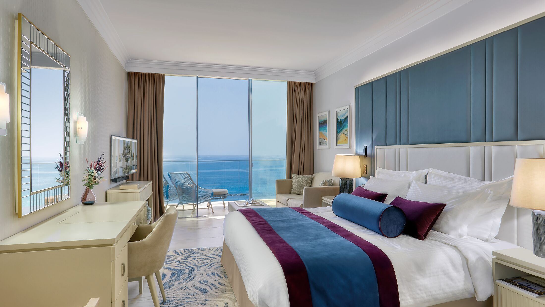 a bedroom with a large bed in a hotel room