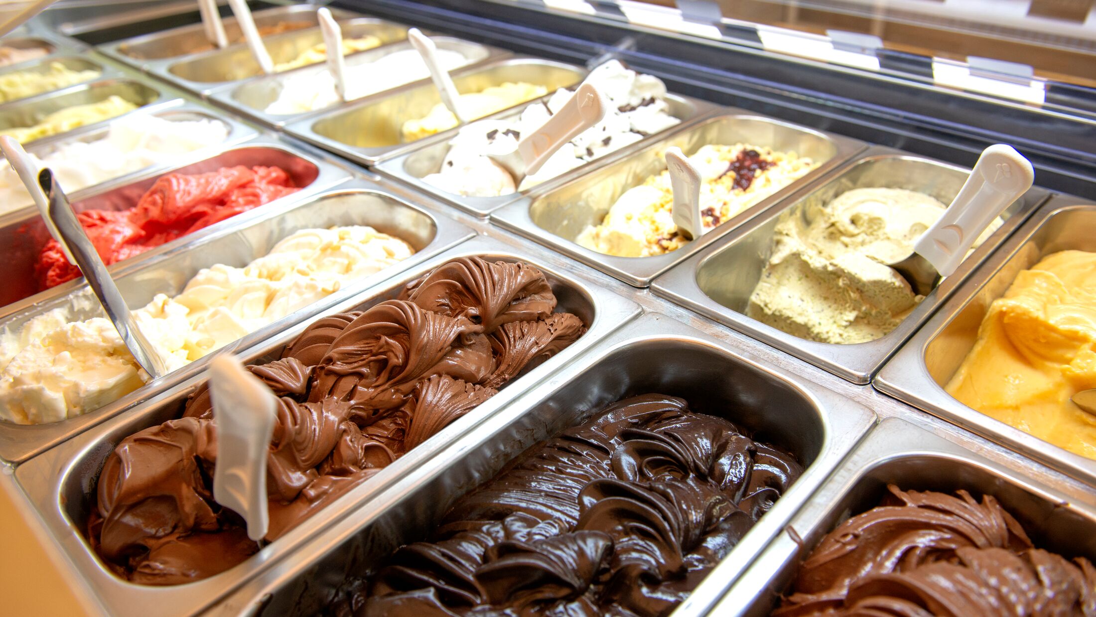 various italian gelato ice cream flavours in modern shop display window