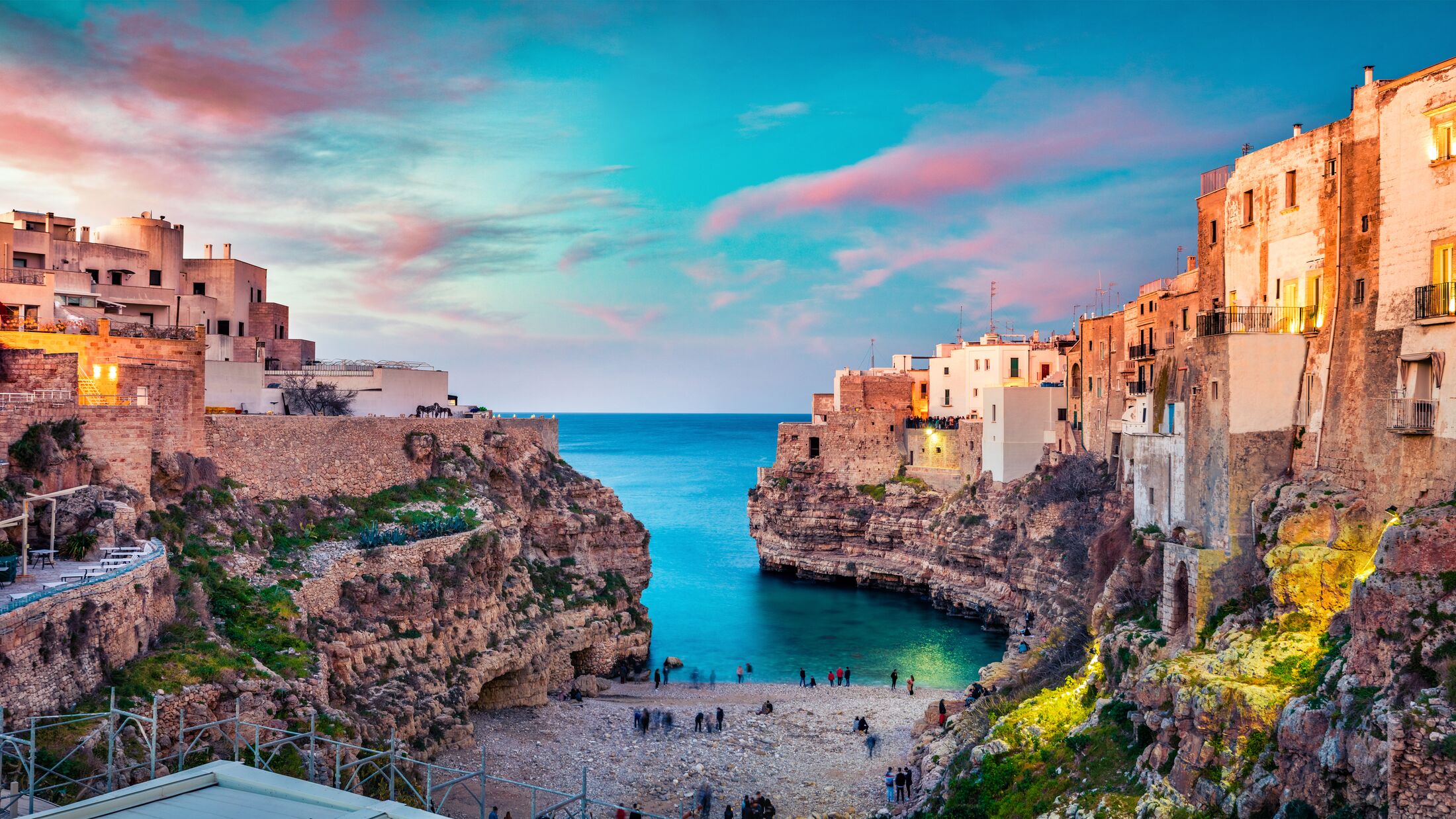 Spectacular spring cityscape of Polignano a Mare town, Puglia region, Italy, Europe. Colorful evening seascape of Adriatic sea. Traveling concept background.