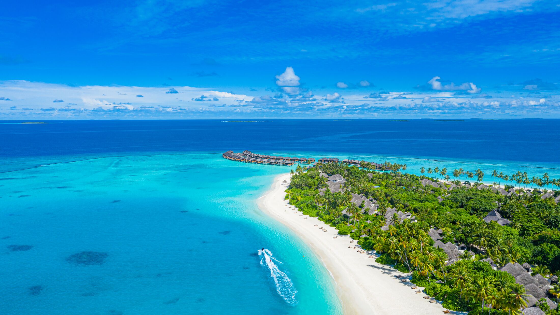 Maldives paradise scenery. Tropical aerial landscape, seascape with long jetty, water villas with amazing sea and lagoon beach, tropical nature. Exotic tourism destination banner, summer vacation