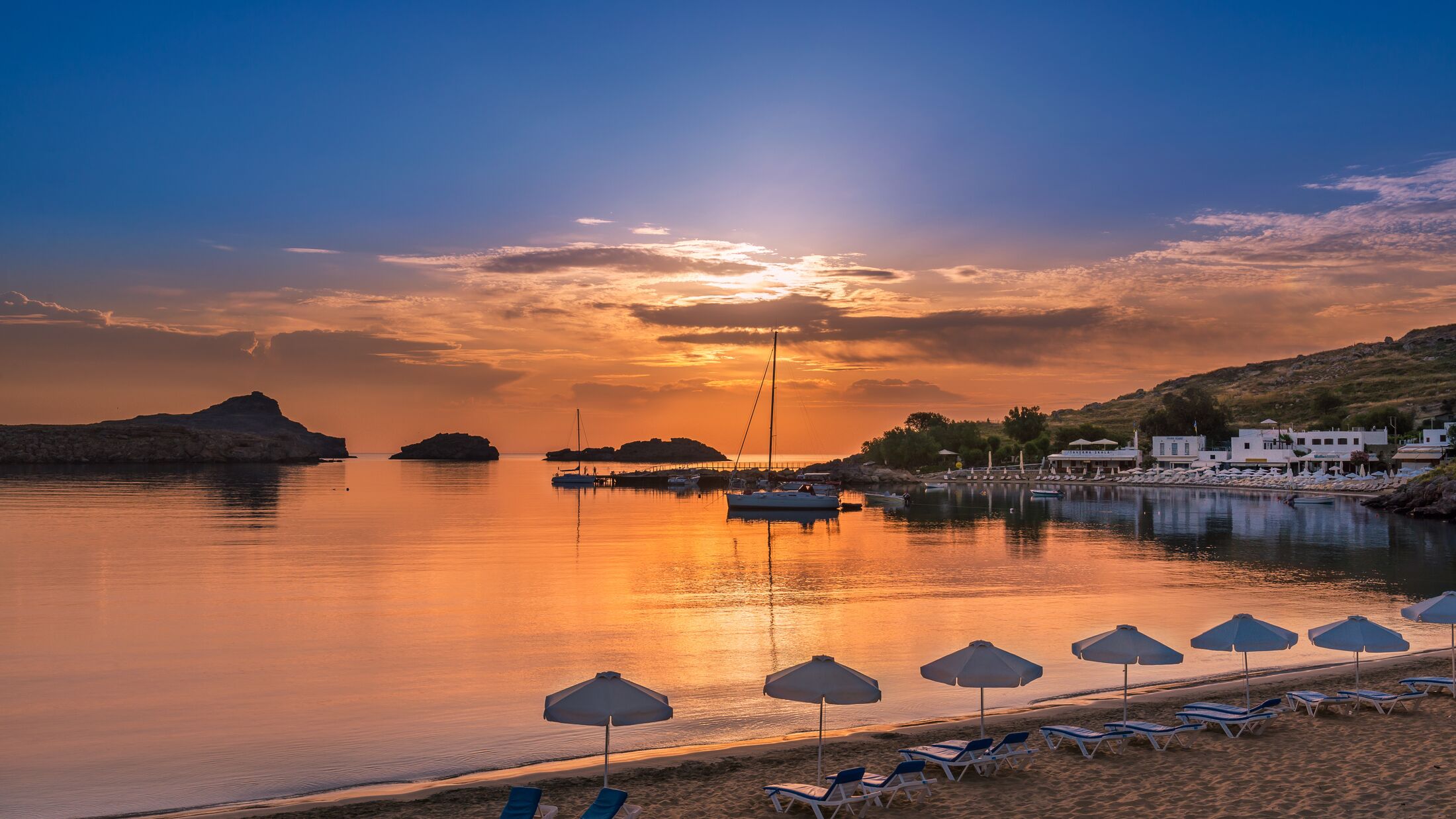 Colorful sunrise in Lindos bay, Rhodes Greece.