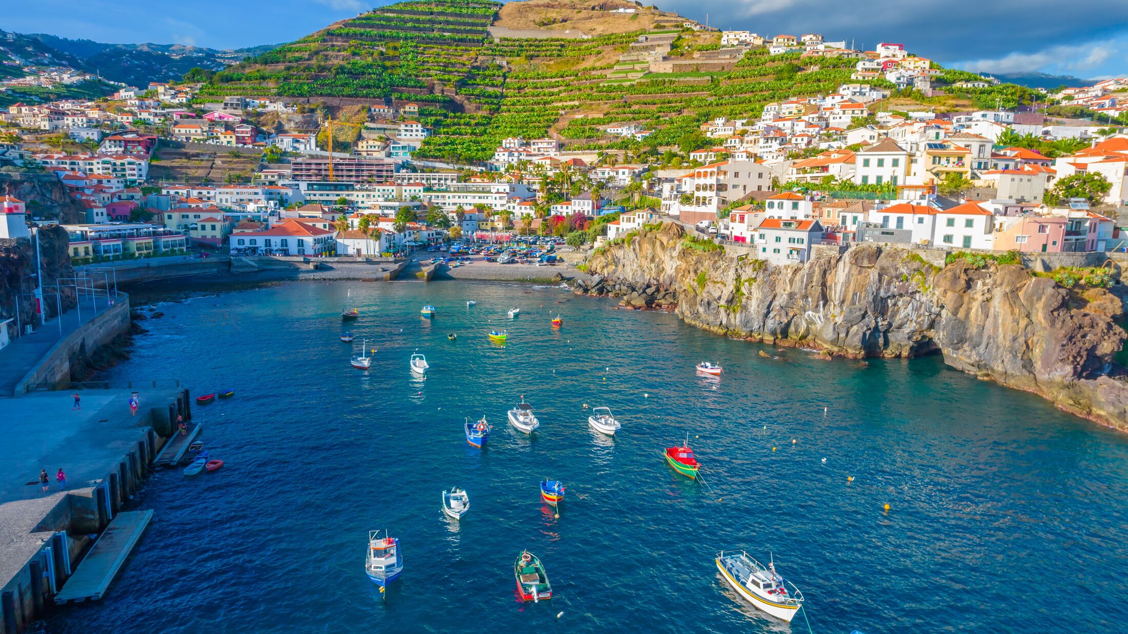 Aerial drone view of Camara de Lobos village panorama near to Funchal, Madeira. Small fisherman village with many small boats in a bay